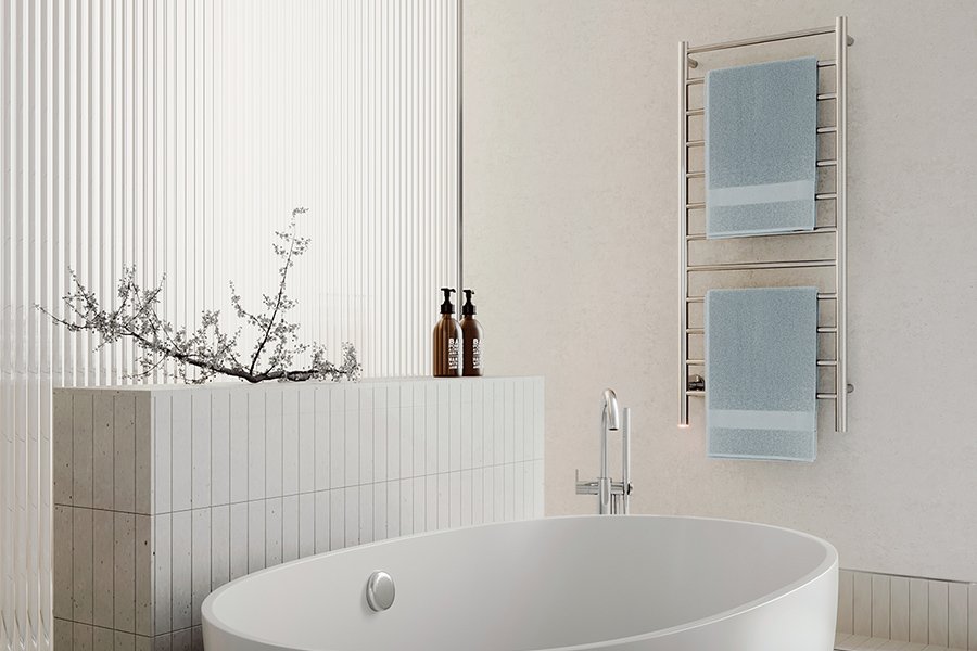 NATURAL 12 Bar heated towel rail in modern bathroom near freestanding bath